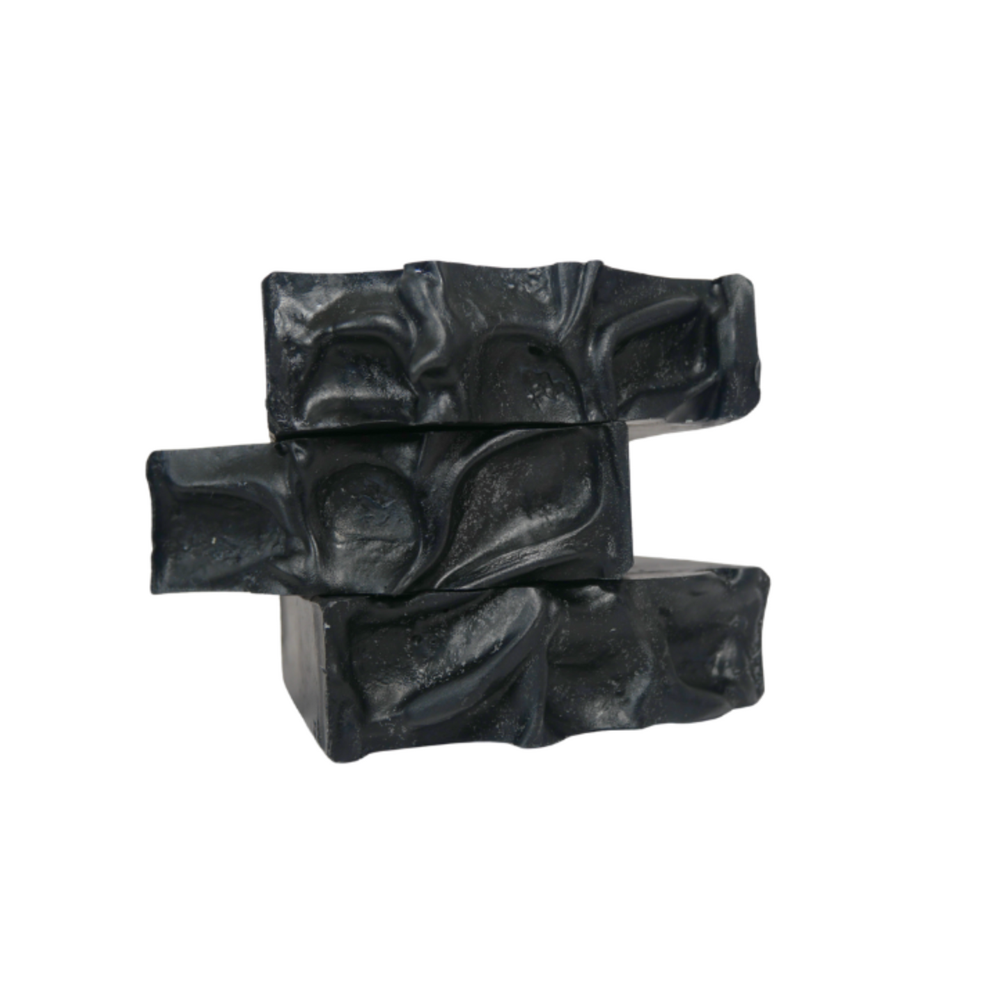 Three charcoal mint soap bars stacked on a white background