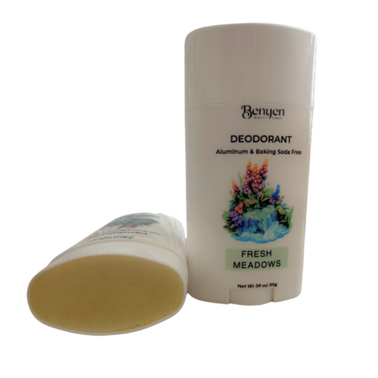 Two deodorant sticks, one open showing a green interior, on a white background.