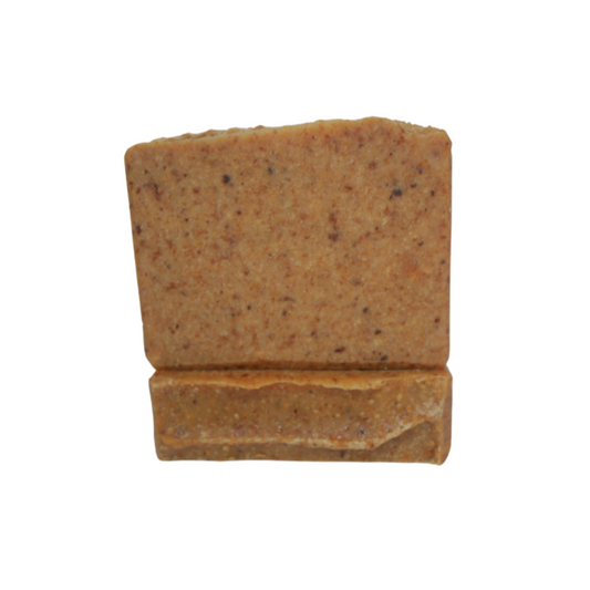 One African soap upright on another flat bar of soap against  white background